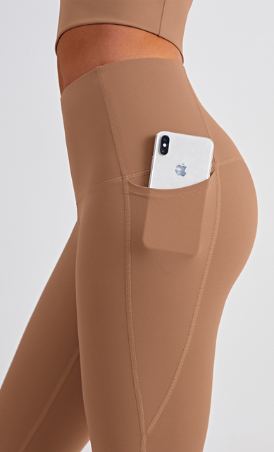 Nuevo diseño de tope elevador sin costuras Traje de yoga de ajuste para mujeres para mujeres