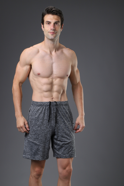 Baltos de deportes de gimnasio transpirables para hombres pantalones cortos de compresión de hombres con calcetines deportivos secos rápidos